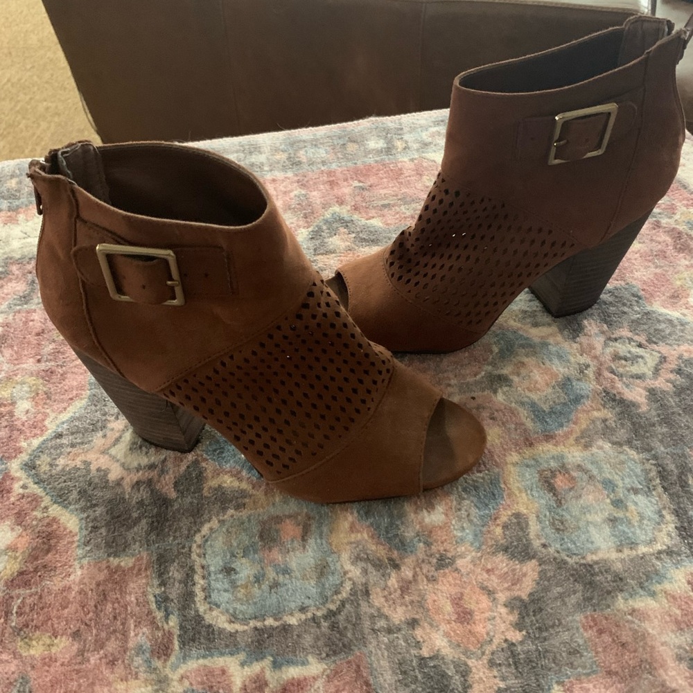 Brown open toe booties.